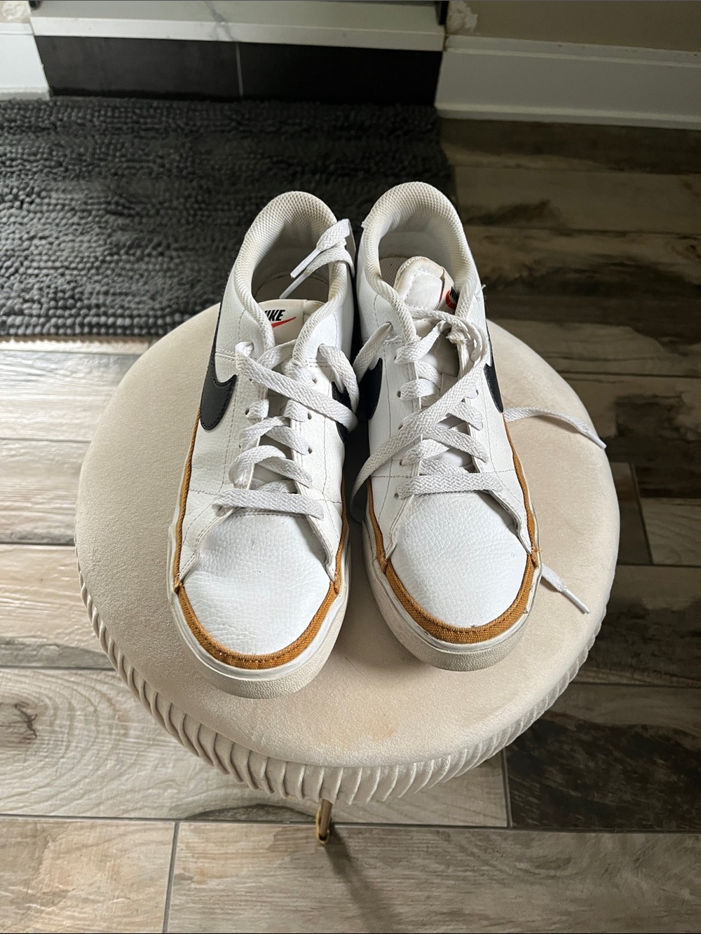Nike White Low-Top Sneakers with Black Swoosh and Brown Accents